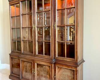 $650; 72 x 16 x 88; Priced to move! Lighted curio cabinet with four beveled glass doors and glass shelves and under storage