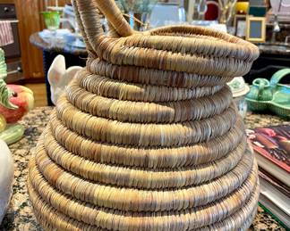 $52; 11"d x 15"h; natural woven basket in the shape of a pitcher