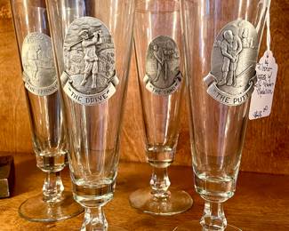 SOLD; 9"h; set of four pilsner glasses with pewter golf medallions