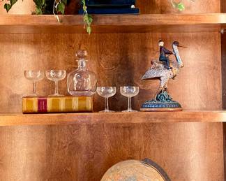 SOLD each (2 available); 12 x 8 x 10; green and black craquelure finish metal planters with gold design and gold lion's head handles including greenery.                                                                                   $16; set of 4 etched champagne glasses.                                                                                                                                         $32; 9"h; glass decanter.                                                                              SOLD; 13"h; monkey riding ostrich resin decor.                                         $38; 12"h; pair of glass candlesticks.                                                                SOLD; 8"h; monkey sculpture decor.                                                                                         SOLD 16"h; vintage globe.