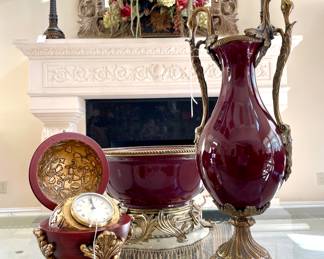 SOLD; 6"d x 10"h; gold-gild wooden clock box.                                      $200; 22"d x 10"h; ceramic and brass Dominic bowl.                                                                                                                             $150; 7"d x 19"h; ceramic and brass Dominic vase with swan handles.