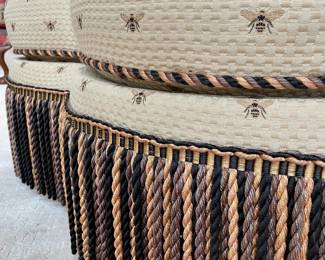 SOLD; 40"d x 17"h; custom-upholstered, medallion-shaped ottoman with embroidered bees and tri-color finge; close up view of fabric and fringe