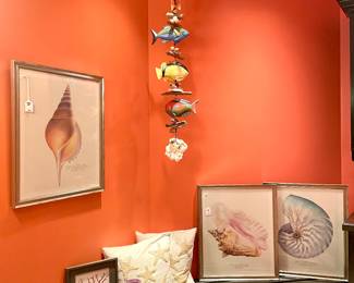 $150 each (4 coordinating available); 22 x 26; seashell framed art by Thomasville.                                                                               $100; 52"h; fish and driftwood mobile.                                                    $18 each (2 available); shell button starfish pillows.                                          $18; 8"d x 9"h; purple vase.                                                                             $28; 11 x 13; framed picture of coral.                                                                            