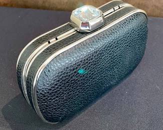 SOLD;6.5" x 4"; hard-case clutch with rhinestone accent