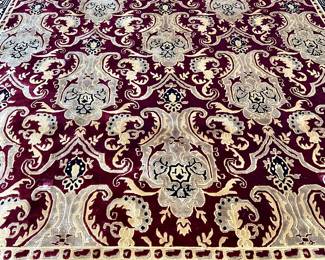 SOLD; approximate 8' x 12'; richly colored rug in wine red and black high lights with thick, high-quality pile