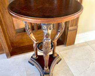 SOLD; 21"d x 27"h; round, wooden table with gold gild and cat-motif legs