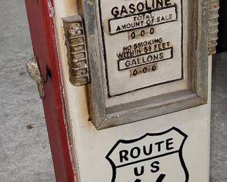 24 inch high wood gas pump. The front Opens on hinges and there are shelves inside