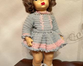 Vintage doll with skates and very red lips