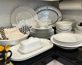 The oval black/white serving plate is sold.