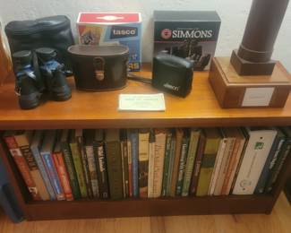 Assortment of Binoculars and Books