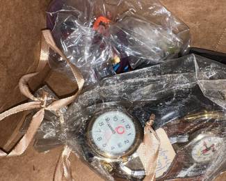 watches in plastic... oooh do I spy with my little eye a Mickey Mouse??