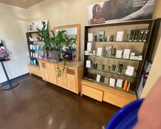 Makeup station, mirror , and shelves with drawer storage underneath.