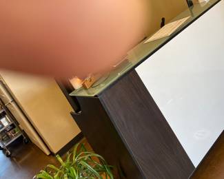 Front desk with glass  topper for welcoming guests.