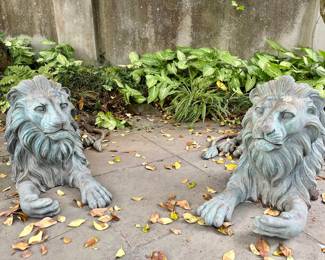 Pair patinated bronze sitting lions
