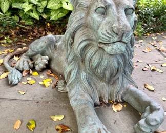Pair patinated bronze sitting lions
