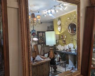 Large gold tone framed mirror 