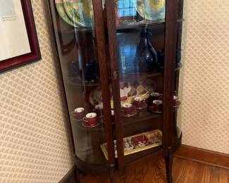 Antique Curved Front Tiger Oak Curio Cabinet