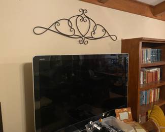 TV and Iron Wall Scrollwork