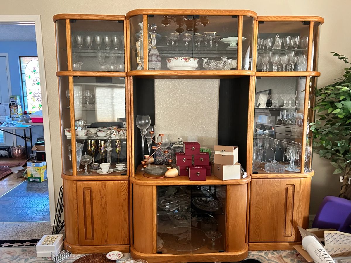 The crystal in the china cabinet is all vintage Fostoria and cups & saucers. China cabinet has 3 sections glass shelves.  