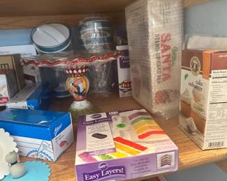 in small closet in kitchen, all baking, cake decorating.