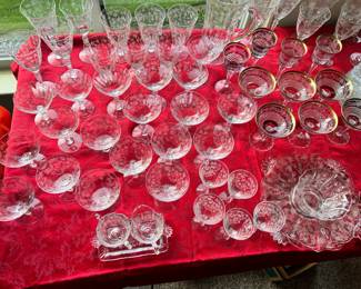 China cabinet full of Fostoria in Navaronne and Chintz pattern.