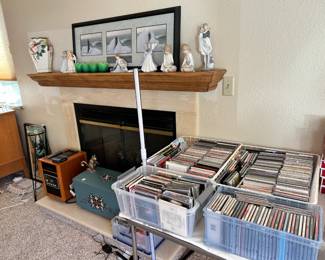 Lladros on mantle. CD'S.