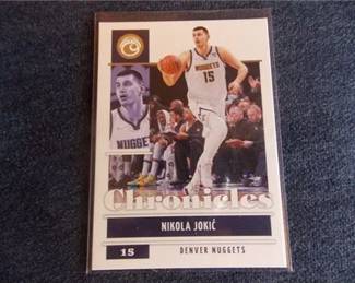 Lot k301 0 Bid(s)
Nikola Jokic 2021-22 Panini Chronicles #20