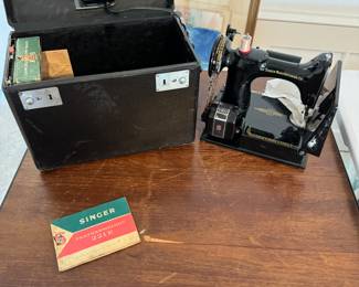 Rare featherweight sewing machine with table. Machine works but needs a new belt