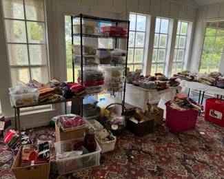 Large amount of quilting supplies including fabric and patterns