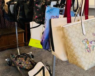 Rack of Designer Purses including Michael Kors & Coach