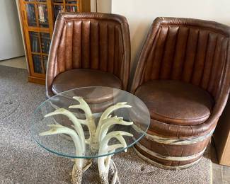 Unique barrel chairs and antler table