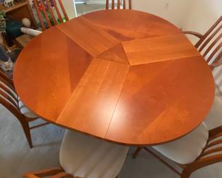 SKOVBY #33 DINING TABLE
Patented round Skovby #33 dining table with 3 folding leaves stored in base
The dining table can be extended from four to six seats comfortably. 
48" - 58" D x 29" H
made in Denmark  