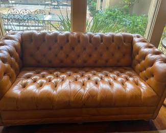 Leather tufted settee