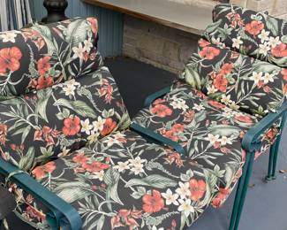 Two Green Iron Patio Chairs with Tropical Design Cushions