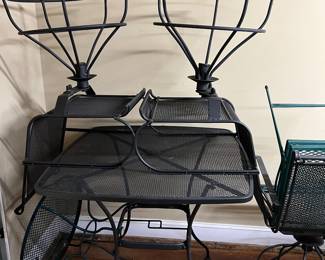 Black metal patio table and swivel chairs