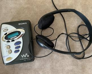 Vintage Sony Walkman AM/FM radio with headphones
