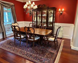 G36 - $2000. SET - Thomasville Mahogany Dining Room Table with 2 captains chairs, 4 regular. 2 leaves. Table Pads. AND. Large lighted china cabinet with glass shelves. Overall in excellent condition - beautiful wood with inlay.