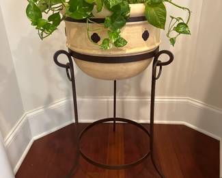 H12 - $60 - Iron Base and Decorative Planter. Measures 17.5" wide x 36" tall.