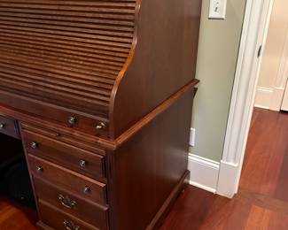 H25 - $250. Roll Top Desk - moves in *1* piece - top does not come off. Measures 33" deep x 60" long x 52.5" tall. Has keys to lock, secret compartment, keyboard drawer, plugs inside. Minor wear on the main surface from use.
