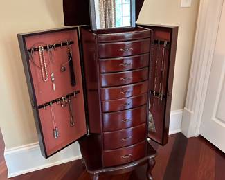 G27 - $75 - Jewelry Box with drawers and doors on the side that open for hanging necklaces. Mirror opens out when top lifts up.