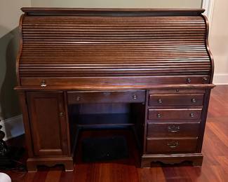 H25 - $250. Roll Top Desk - moves in *1* piece - top does not come off. Measures 33" deep x 60" long x 52.5" tall. Has keys to lock, secret compartment, keyboard drawer, plugs inside. Minor wear on the main surface from use.
