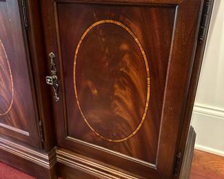 G36 - $2000. SET - Thomasville Mahogany Dining Room Table with 2 captains chairs, 4 regular. 2 leaves. Table Pads. AND. Large lighted china cabinet with glass shelves. Overall in excellent condition - beautiful wood with inlay.