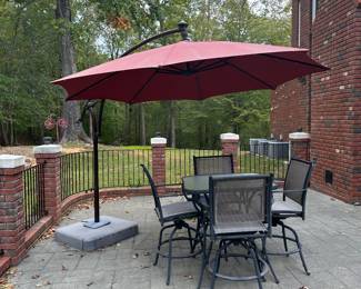 G41 - $150. Square Bar Height Patio Set with swivel chairs. Umbrella included if you want it - still works but has minor storm damage.