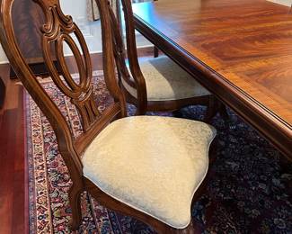 G36 - $2000. SET - Thomasville Mahogany Dining Room Table with 2 captains chairs, 4 regular. 2 leaves. Table Pads. AND. Large lighted china cabinet with glass shelves. Overall in excellent condition - beautiful wood with inlay.