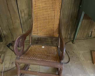 Antique Wood Rocking Chair with Cane Back and Seat