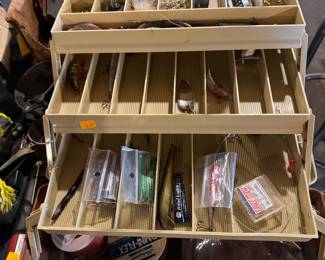 fishing gear, there are two boxes with some lures and other things... plus a couple of rods and reels