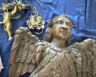 Brass or bronze cherub swag lamp and a mythical winged man.