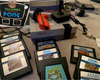 Atari games, Pong Plug and Play, Nintendo NES with controllers and games