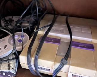 Super Nintendo with many games.