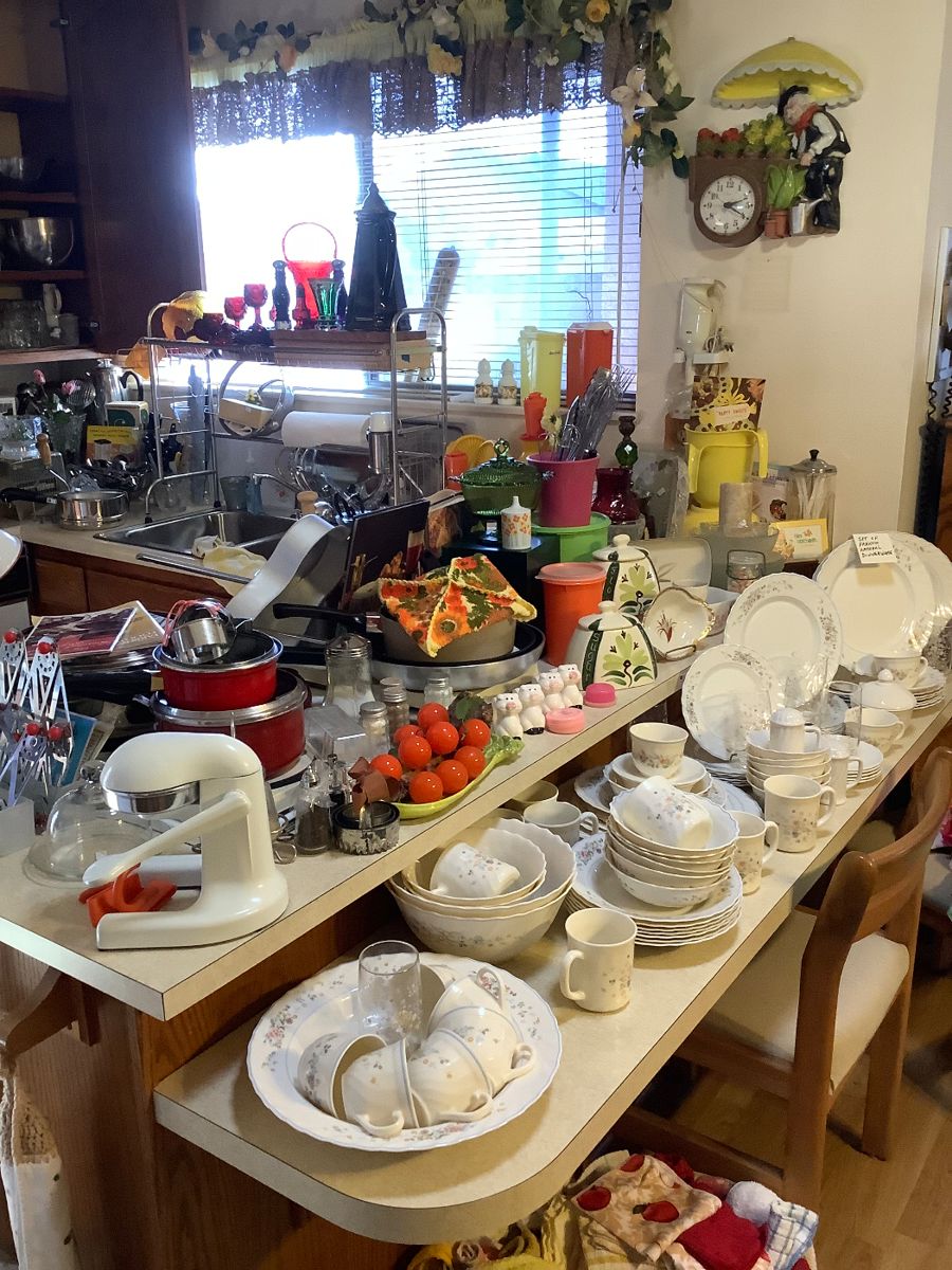 Large set of French Arcopal dinnerware, vintage juicer, vintage kitchen aid mixer, vintage sugar and flour canisters, vintage colorful Tupperware, vintage ruby red Avon glasses 